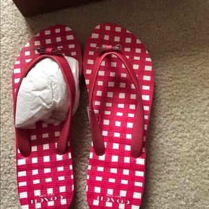 Never worn Coach flip flops